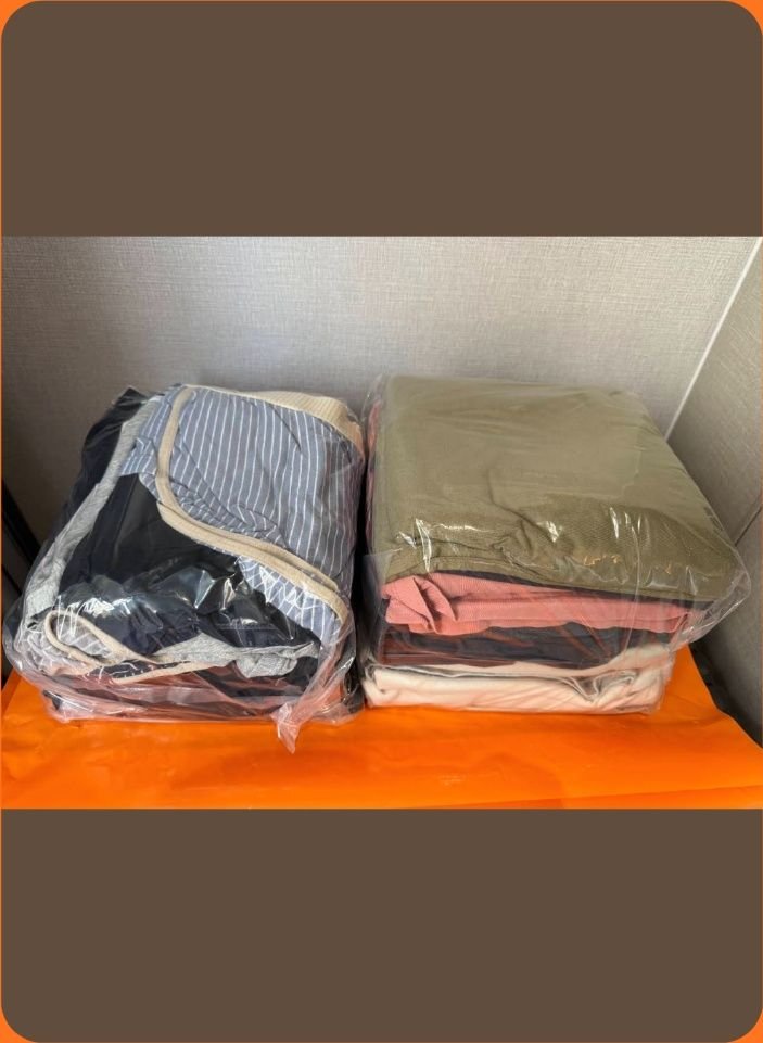 Neatly folded clothes in a transparent bag - 1997 Laundry